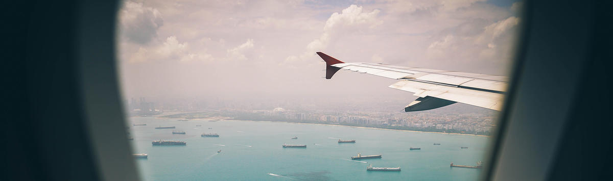 View from airplane with wing and water below